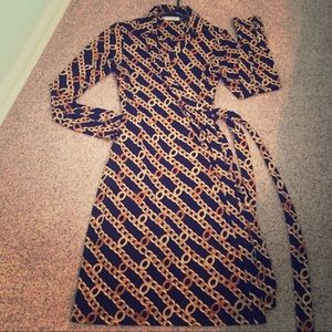 Awesome CK long sleeved wrap dress in black & gold